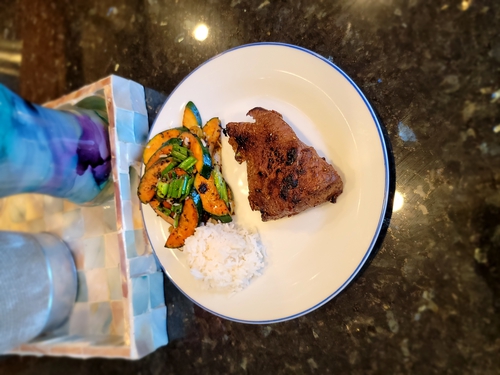Garlic Butter Grilled steak with jasmine rice and roasted Greens
