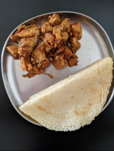 Dosa with chicken curry