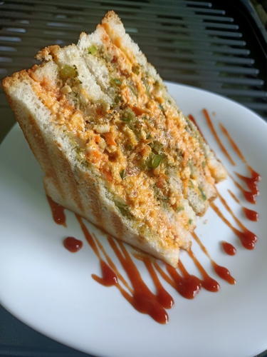 Triple layer cheesy grilled paneer sandwich