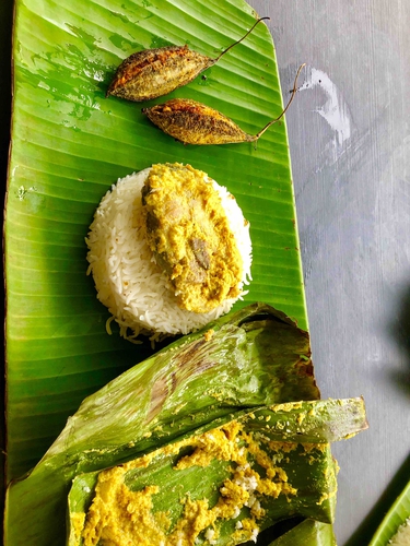 fish paturi ( fish cooked in banana leaves)